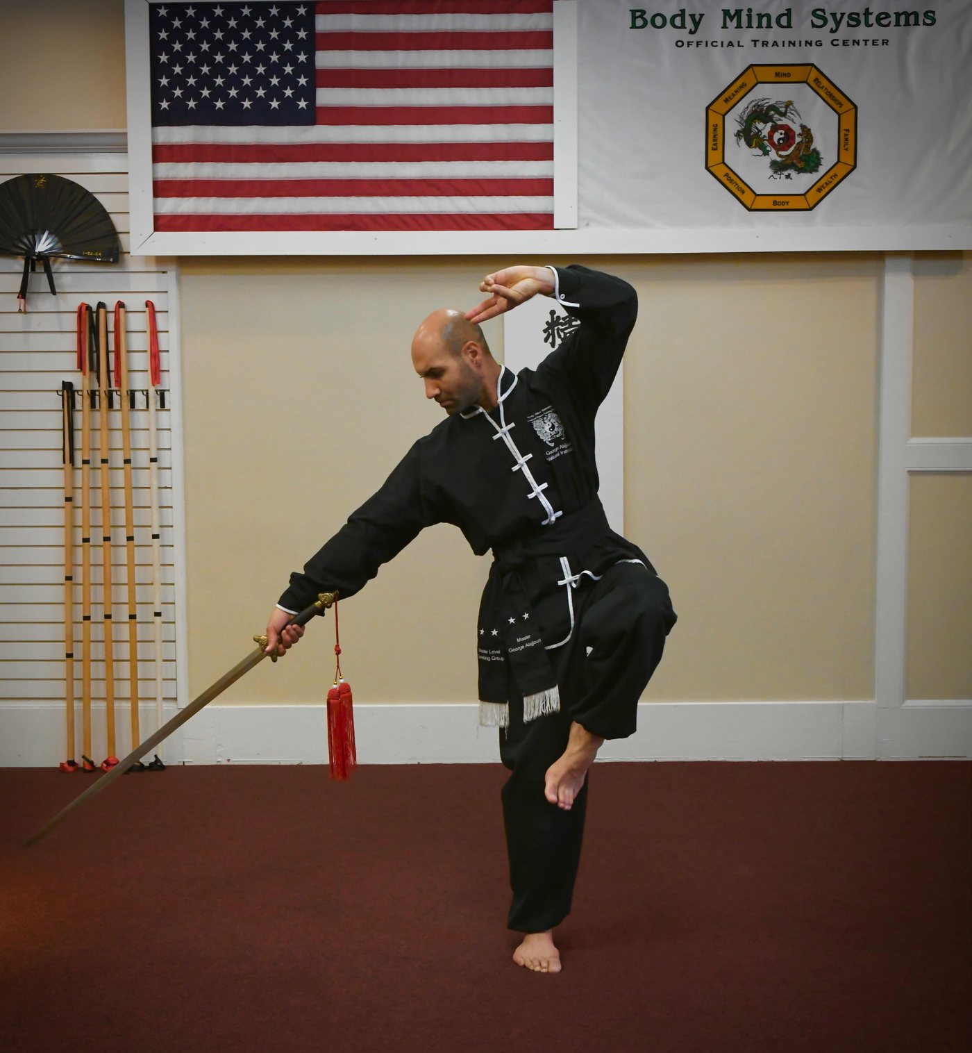 Sword form against a tan wall