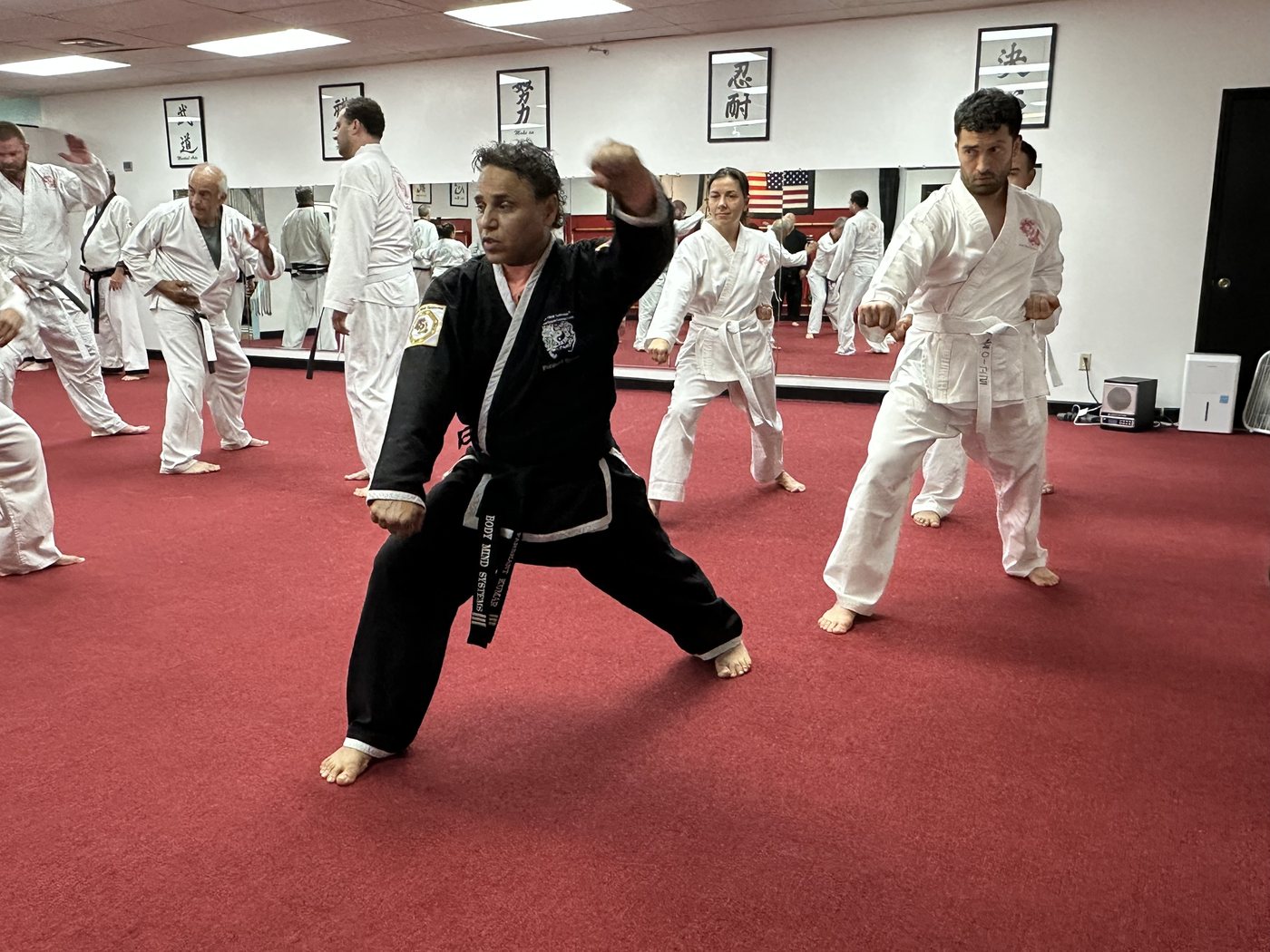 Black belt striking during class